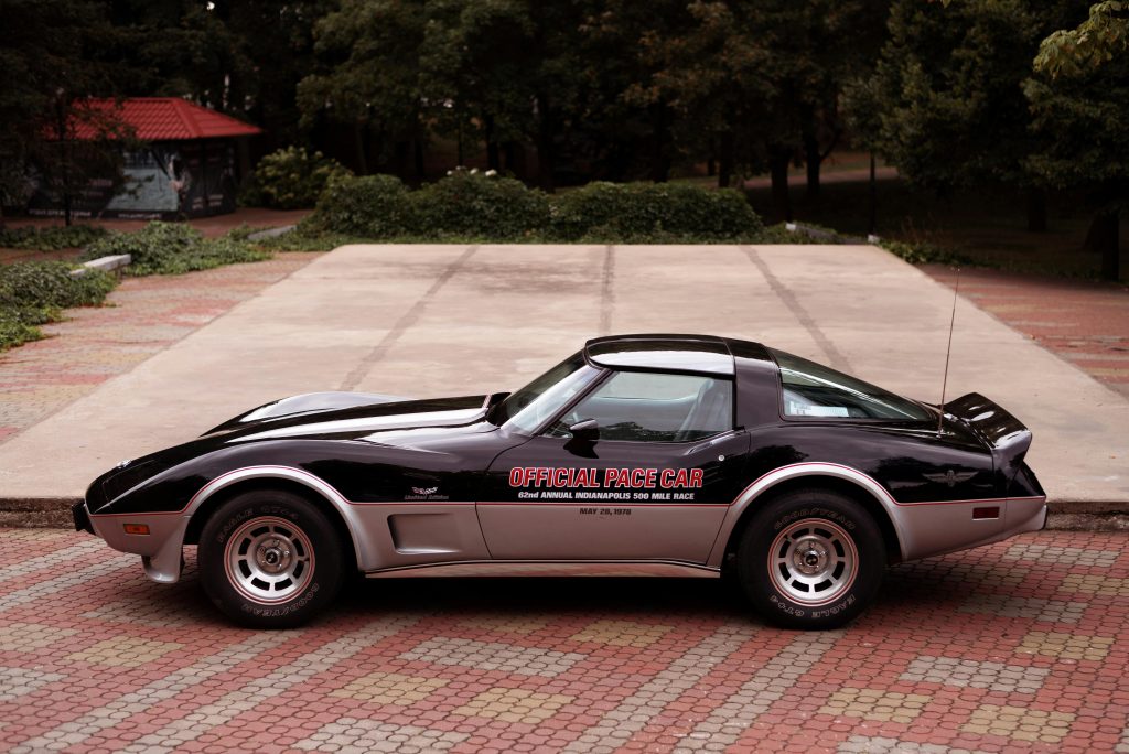 Side view of a Chevrolet Corvette parked outdoors, showcasing luxury sports car design.